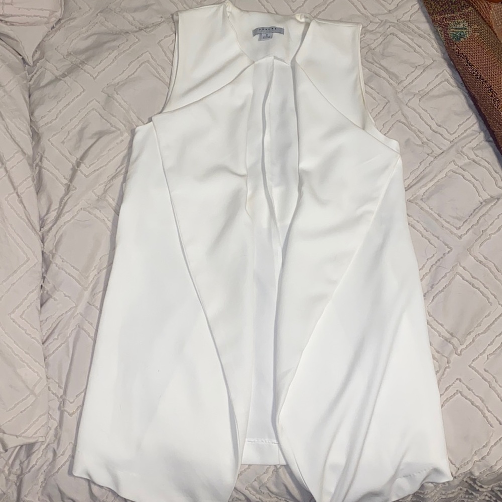 Sleeveless white blazer